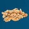 Shelled walnuts on a blue background.